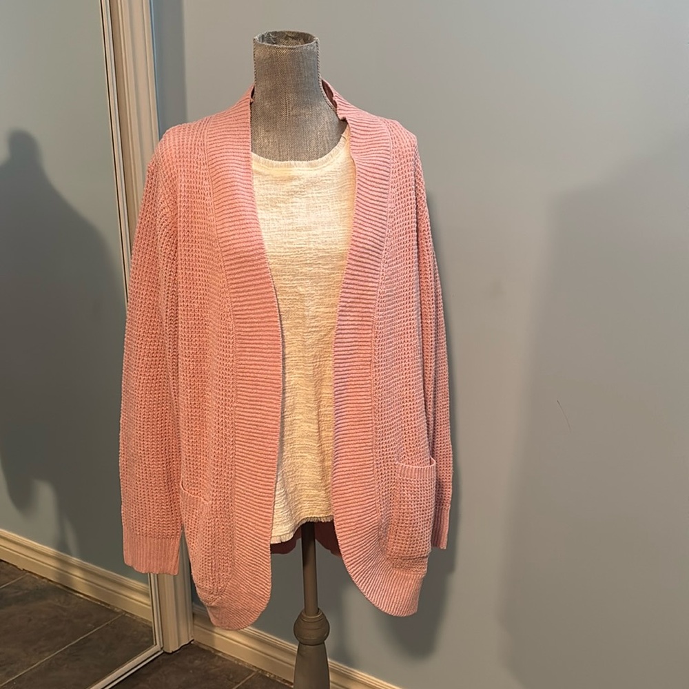 Pink sweater by Flovey, size large.
